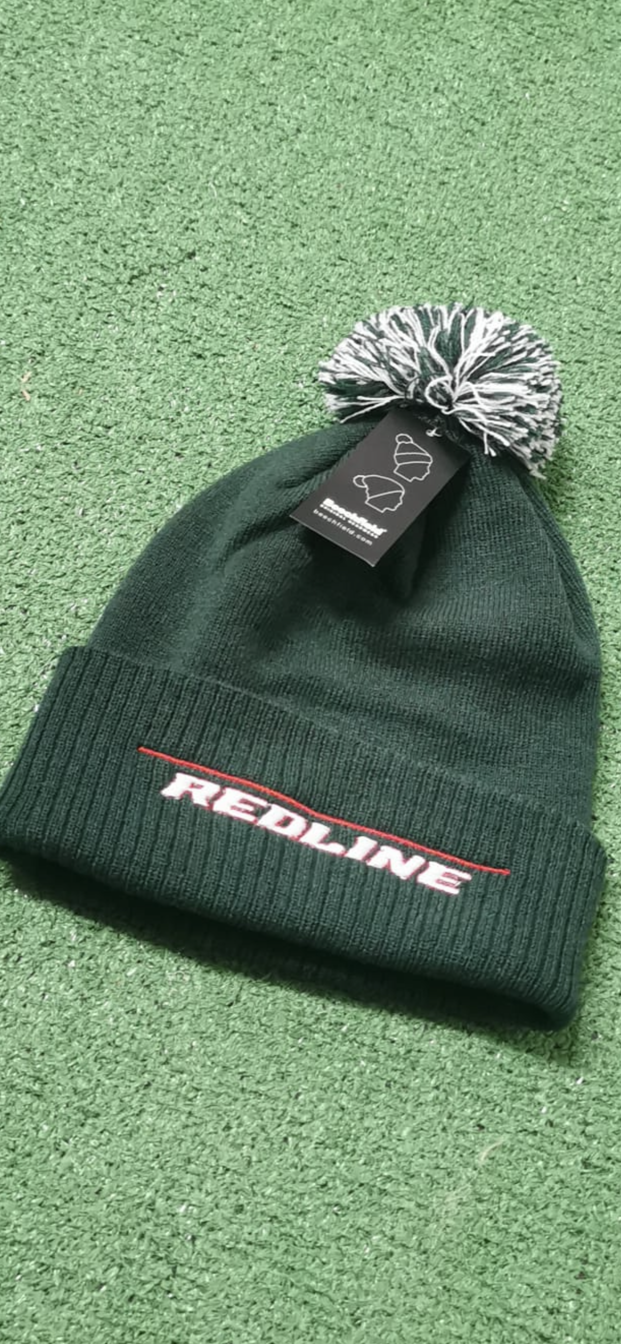 Green bobble hat